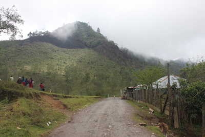 a dirt road looking over a mountain in Guatemala