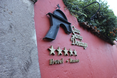 the words Casa Satigo Domiago with five stars below on the side of a building